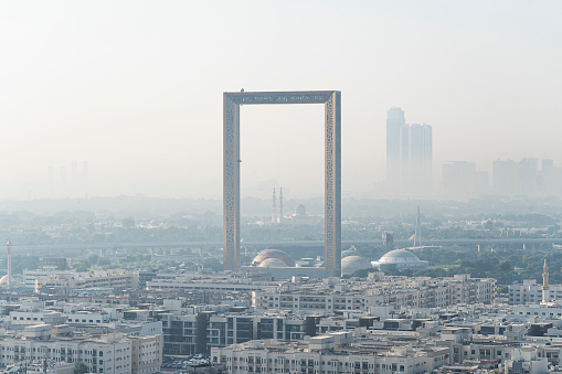 Dubai, UAE. November 26, 2022: Amazing panoramic view of the world largest gold frame made in Dubai, UAE Dubai frame featuring Dubai skyline on day