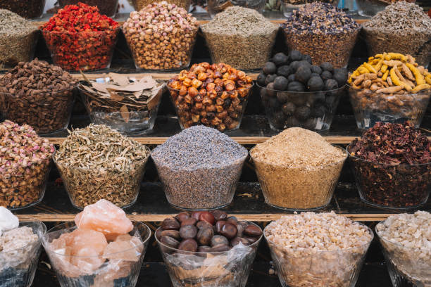 istock selection of different fragrant spices on store counter. 1506273484