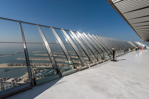 observation deck at the top of a skyscraper on the roof. View of the artificial Palm Jumeirah island