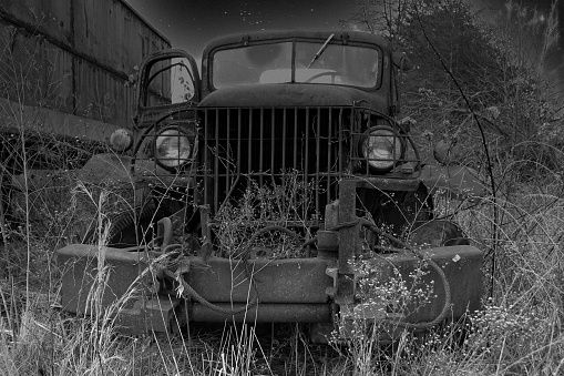 Old large truck used for parts. Most likely used by the military 1940-1960