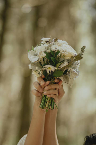 istock Bride and Groom holding bouquet 1506357490