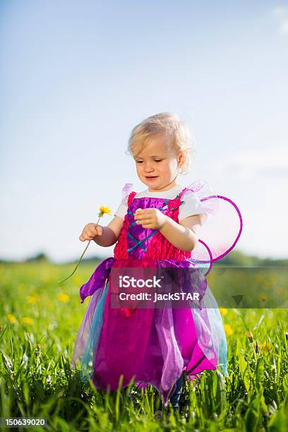 Girl In Fairy Costume Playing In Field Stock Photo - Download Image Now - 12-17 Months, Agricultural Field, Babies Only