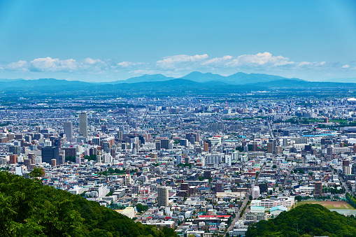 Cityscape of Gifu City, Gifu Prefecture, seen from Mt. Kinka Observation Deck on a sunny day