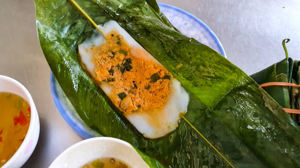 istock Nam Cake (Steamed Shrimp Rice Cake) On Dish With Fish Sauce And Chili. 1506561312