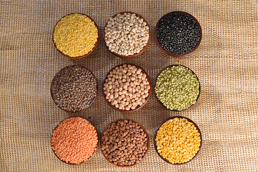 Top view of all lentils beans and legumes in bowl, grocery concept