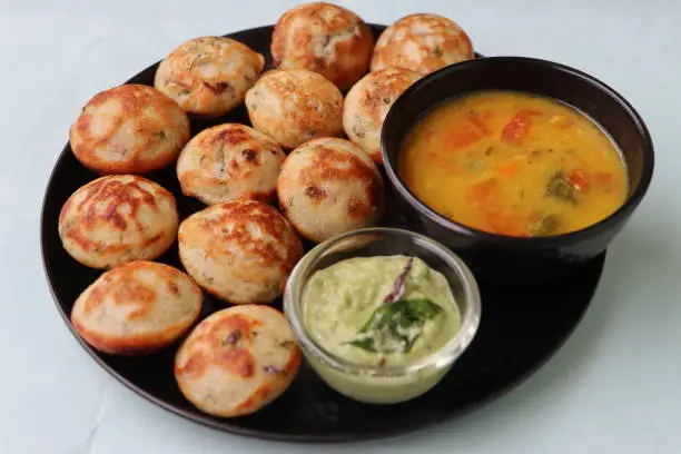 Photo of Appum or Appe, Appam or Mixed dal or Rava Appe served with sambar. A Ball shape popular south Indian breakfast dish