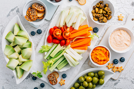 Crudites platter, raw vegetarian food or party vegetarian platter with various veggie snacks and dips