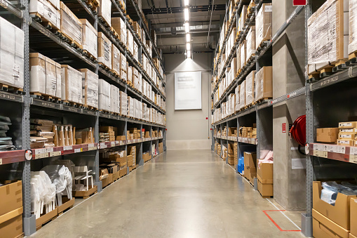 Large warehouse corridors, warehouse storage and distribution of goods and goods on the shelf.