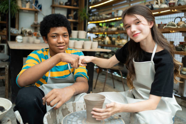 istock Diverse Expressions: Boy and Girl Unite in Clay Workshop to Create Artistic Masterpieces 1506610678