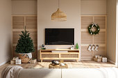 Modern Living Room Interior With Christmas Tree, Gift Boxes, Smart Tv, Cabinet And Sofa