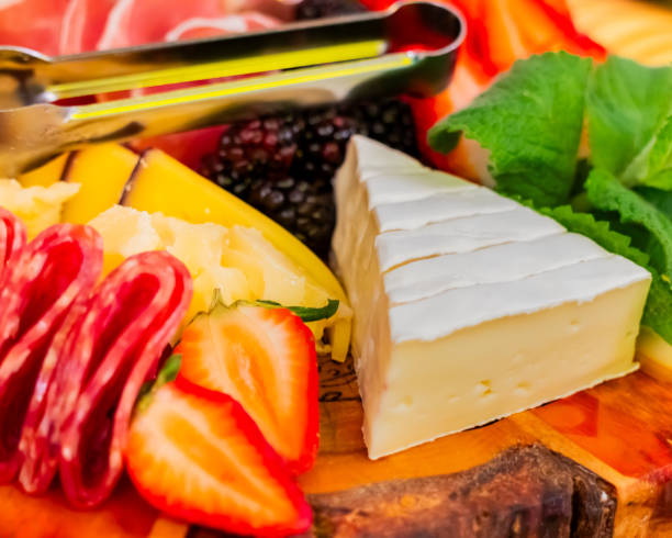istock cold cuts board with cheeses, fruits and jams 1506629050