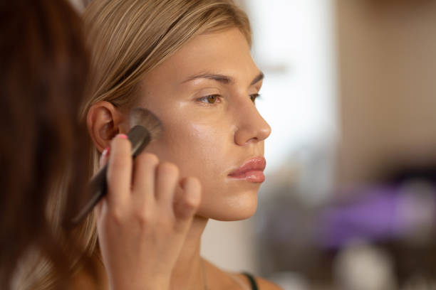 istock Make-up artist work on beautiful woman. Real people. 1506637232