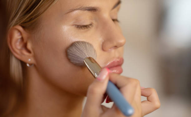 istock Make-up artist work on beautiful woman. Real people. 1506637615