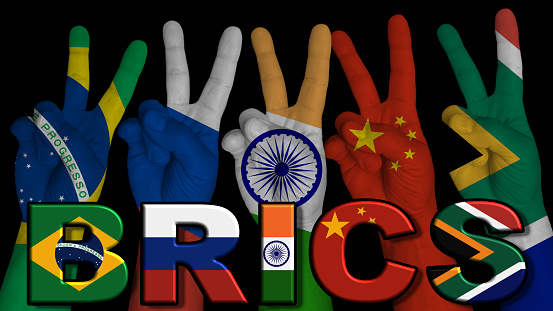 BRICS 5 Hands in victory sign with flags of member countries, on a black background