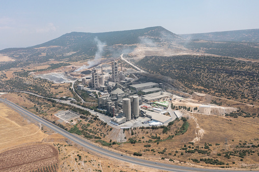 Aerial view of industrial factory. Structures of cement producing plant.