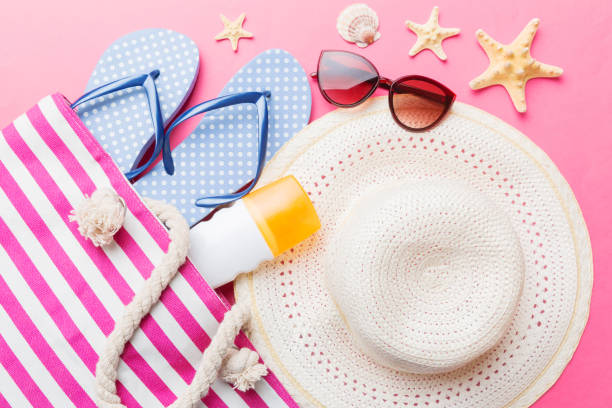 istock beach accessories flat lay top view on colored background Summer travel concept. Bag with starfish and sea shell. Top view 1506709878
