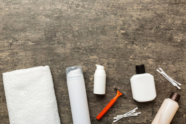 istock Composition with bath cosmetics on table. razor, toothpaste, soap, gel, toothbrush, mouthwash and other various accessories. Cosmetics for skin health. Bath Mockup for your logo 1506710413