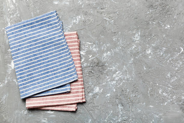 istock top view with blue kitchen napkin isolated on table background. Folded cloth for mockup with copy space, Flat lay. Minimal style 1506710437