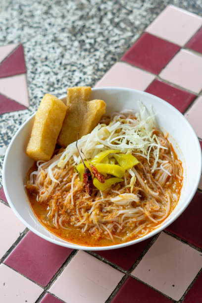 istock Rice noodles in fish curry sauce with vegetables 1506719597