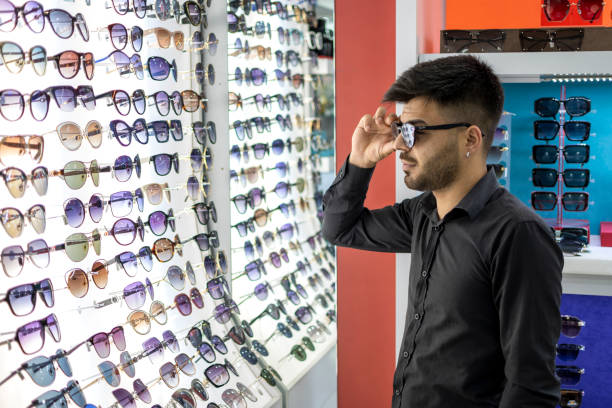 istock Young man choosing sunglasses 1506727790