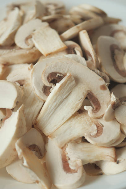 istock Fresh champignons mushroom in a white bowl on table 1506743002