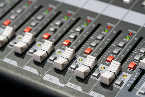 Microphone place on digital mixer with sound electronic device in Control room.