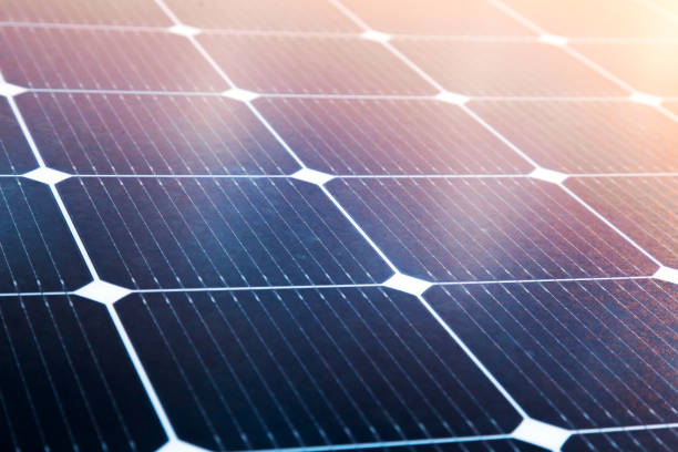 istock Solar panel close-up with the rays of the setting sun in the corner. 1506755593