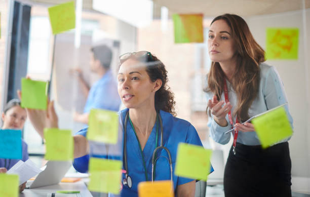 istock female doctor brainstorming with colleagues 1506784041