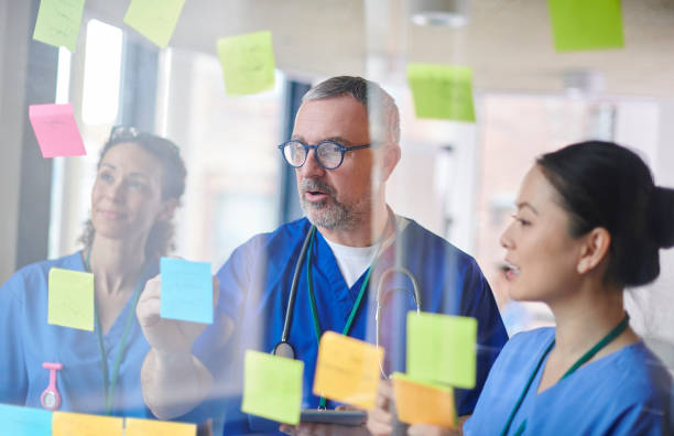 istock doctor brainstorming with colleagues 1506785166
