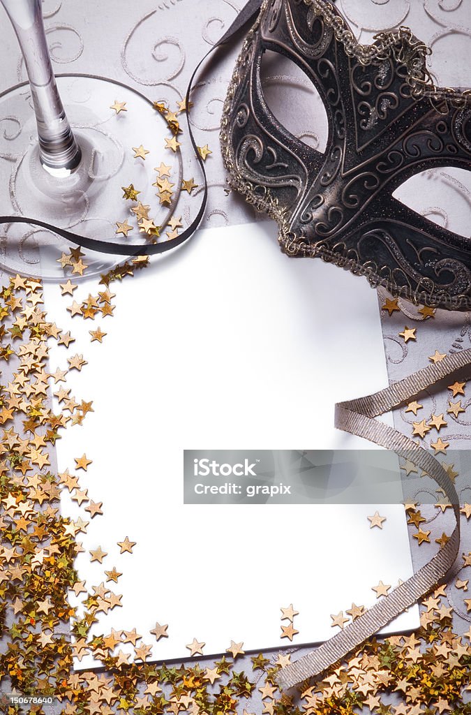 party still life with blank paper venetian mask and confetti with blank paper for your text Costume Stock Photo