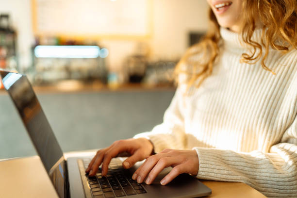 istock Female hands working on a laptop, close-up. Freelance, online course, remote work and lifestyle concept. 1506788509