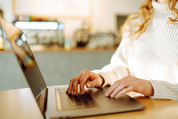 istock Female hands working on a laptop, close-up. Freelance, online course, remote work and lifestyle concept. 1506788805