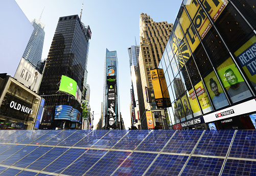 Solar Power Station over urban skyline Times Square Manhattan NY, USA.