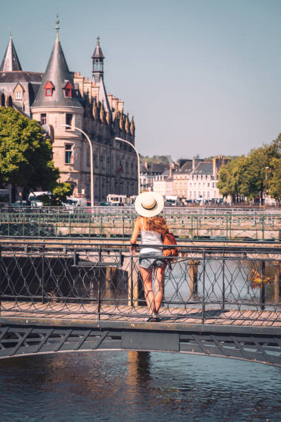 istock quimper city-  woman on the gateway 1506809395
