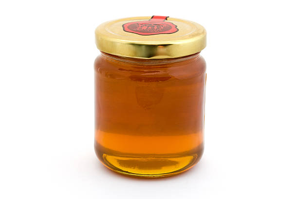 istock Jar of Honey over white 150681172