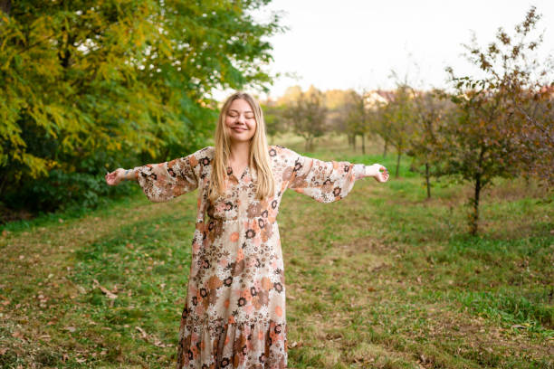 istock Woman whit hands outstretched standing in nature 1506815331
