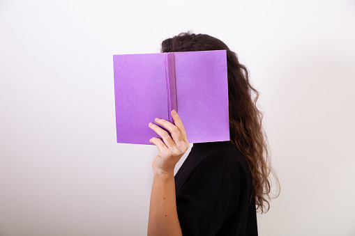 Woman holding a book. Reading a book