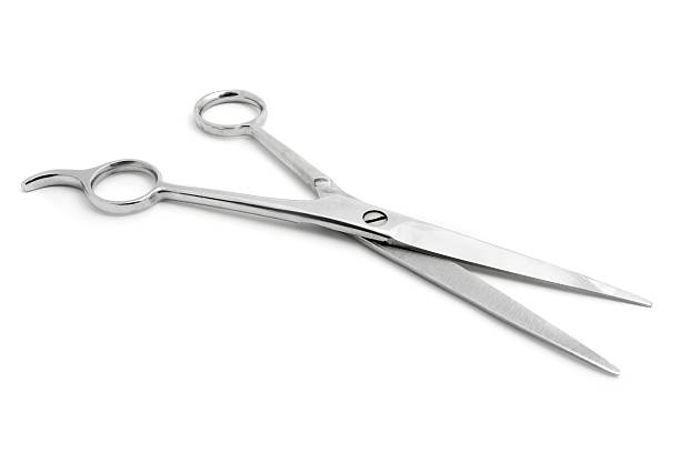 istock Open pair of scissors isolated over white 150681747