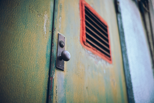 Rusted doors and doorknobs with industrial design.