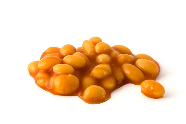 Baked beans isolated over white Baked beans in tomatoe sauce isolated on a white background baked beans stock pictures, royalty-free photos & images