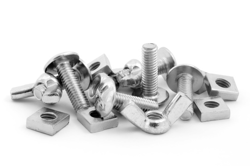 Pile of nuts and bolts isolated on a white background