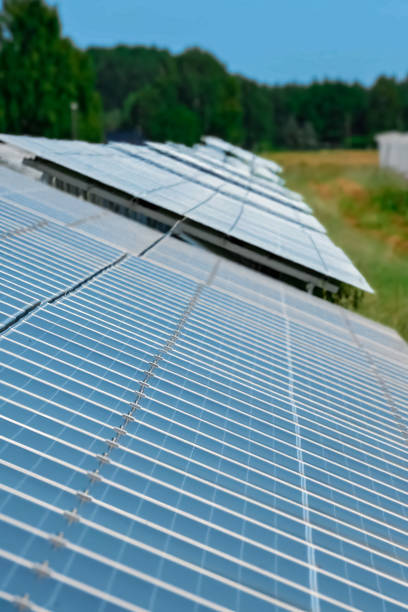 istock Rows of solar panels in a field. Solar power plant. with solar panels. Alternative energy source. Solar farm. 1506843355