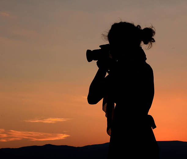 istock Photographer woman silhouette 150685156