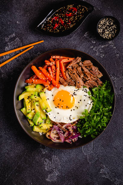 istock Traditional Korean dish Bibimbap: rice with vegetables beef and egg. 1506861889