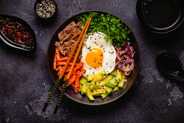 istock Traditional Korean dish Bibimbap: rice with vegetables beef and egg. 1506861892