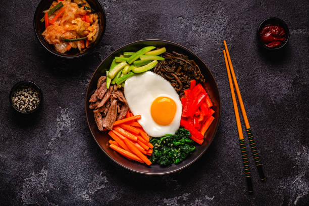 istock Traditional Korean dish Bibimbap: rice with vegetables beef and egg. 1506863016