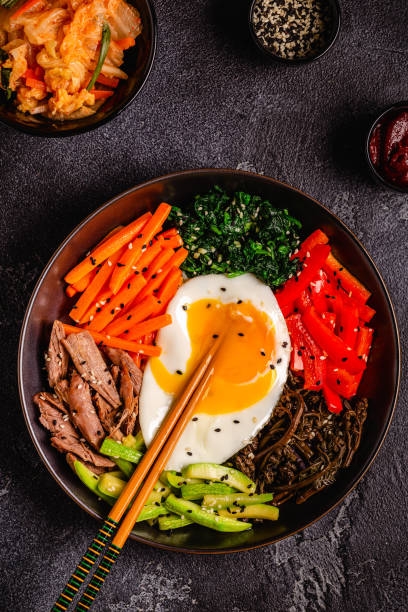 Traditional Korean dish Bibimbap: rice with vegetables beef and egg.