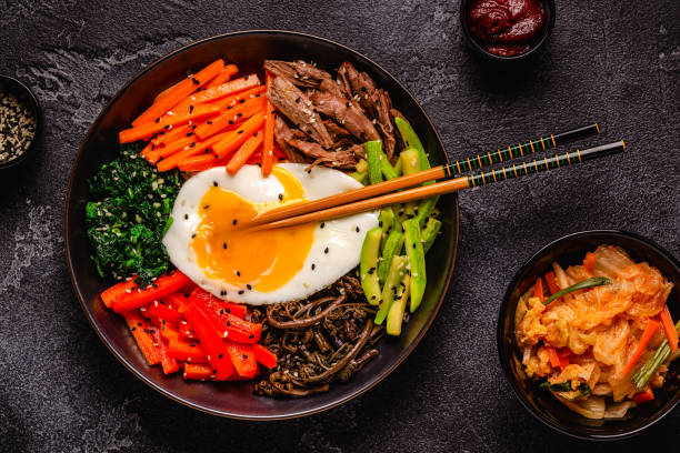 istock Traditional Korean dish Bibimbap: rice with vegetables beef and egg. 1506865300