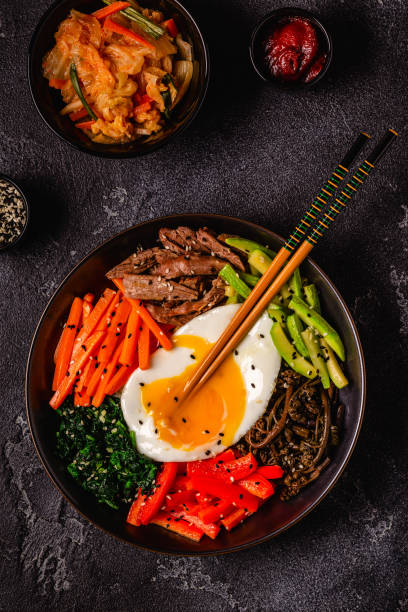 istock Traditional Korean dish Bibimbap: rice with vegetables beef and egg. 1506865825