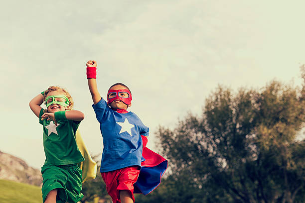 Be Super Two superheroes are ready to save the world from evil and tyranny. only boys stock pictures, royalty-free photos & images